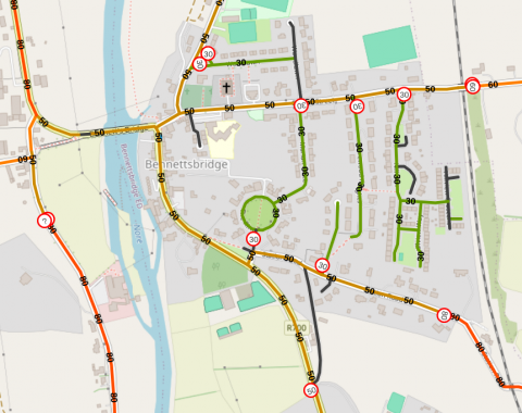 Screenshot of the mapnik rendering of Bennetsbridge, overlayed by colored roads (depending on the speed). A few traffic signs with their speed limit are visible.